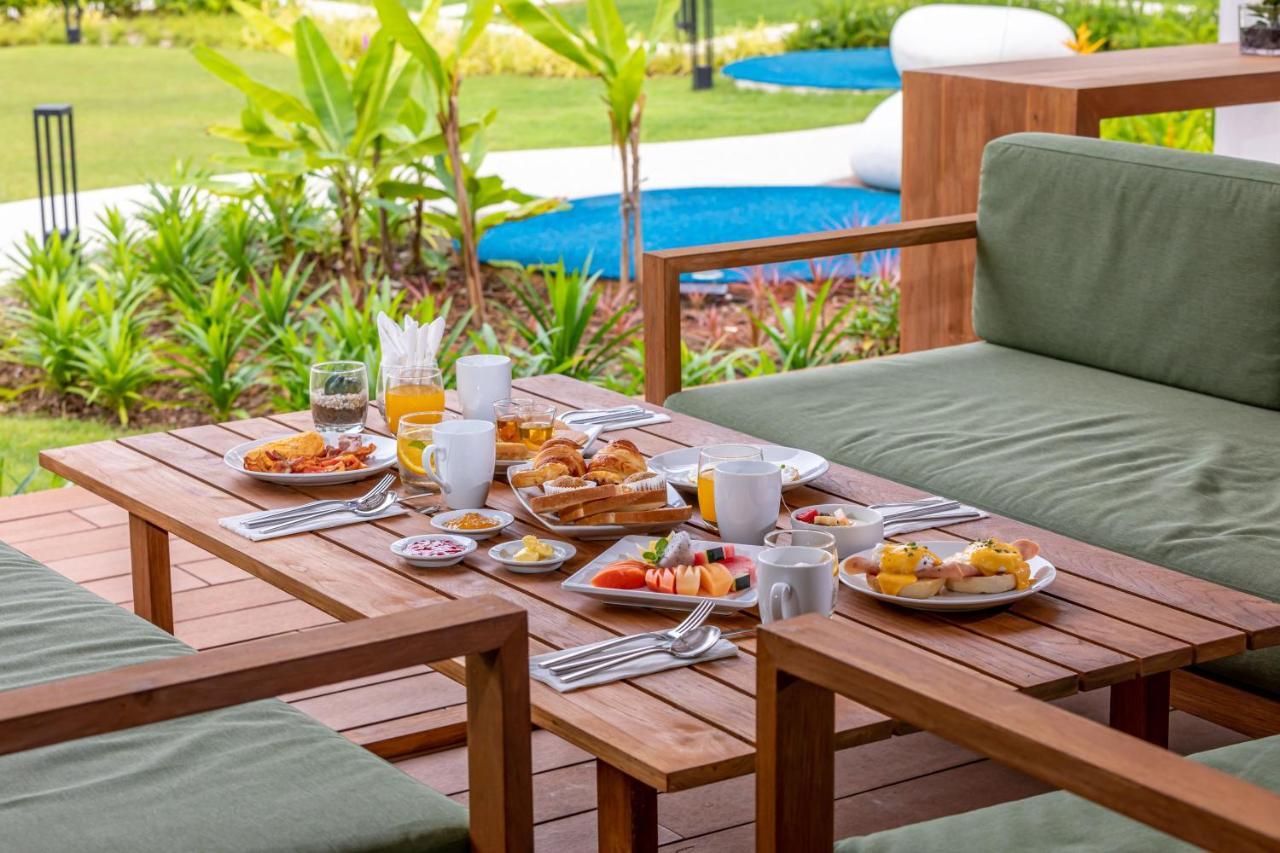 Outrigger Khao Lak Beach Resort - Sha Extra Plus Extérieur photo A breakfast table
