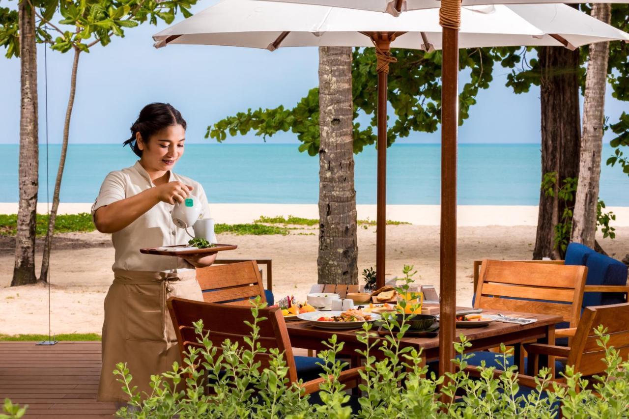 Outrigger Khao Lak Beach Resort - Sha Extra Plus Extérieur photo A Thai waitress at a resort